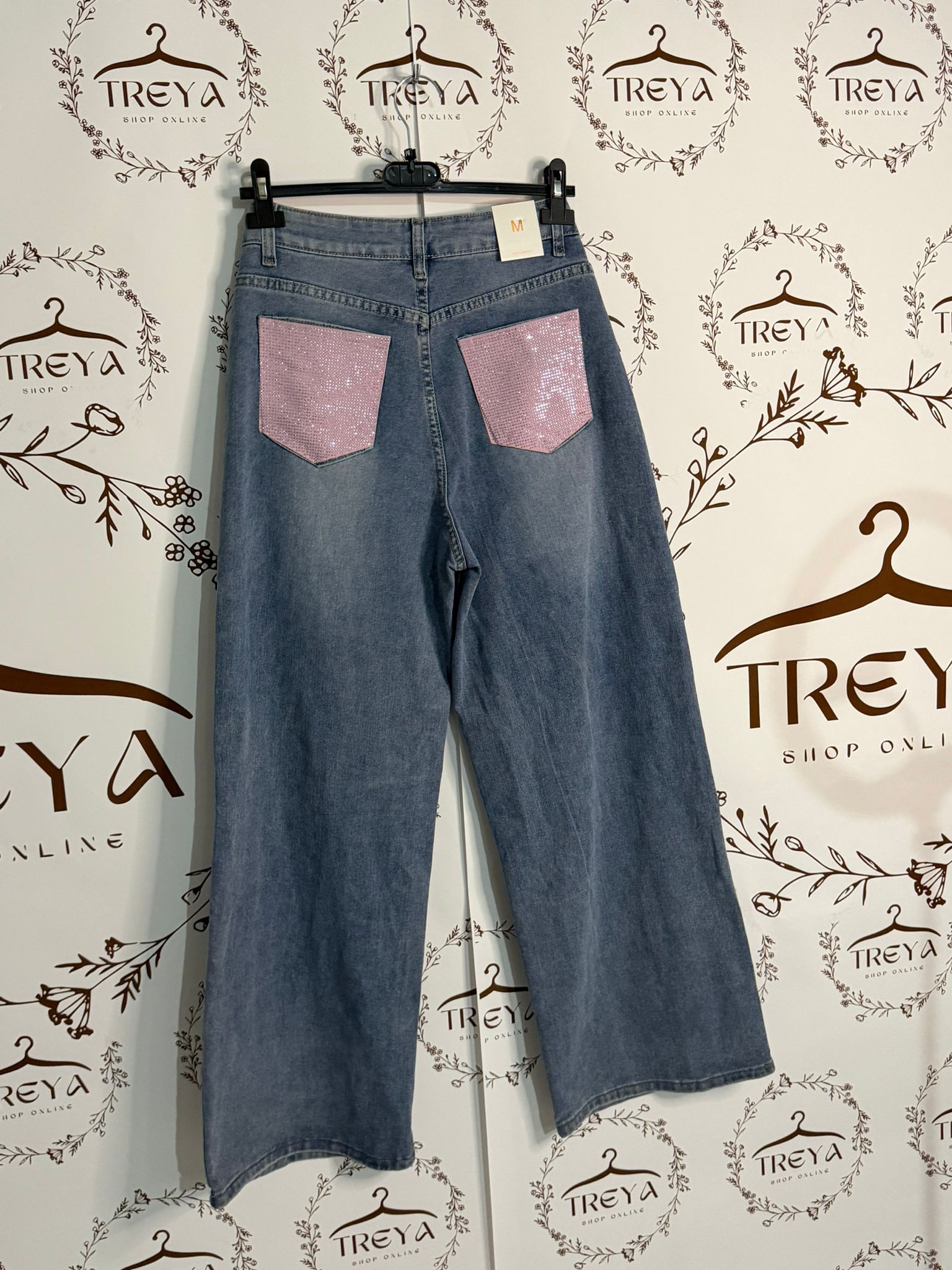 JEANS A GAMBA LARGA CON TASCA STRASS